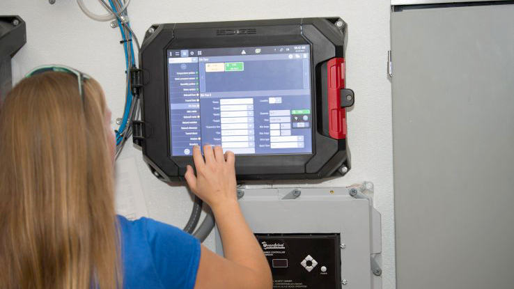 Auburn College of Agriculture, Biosystems female student working control panel