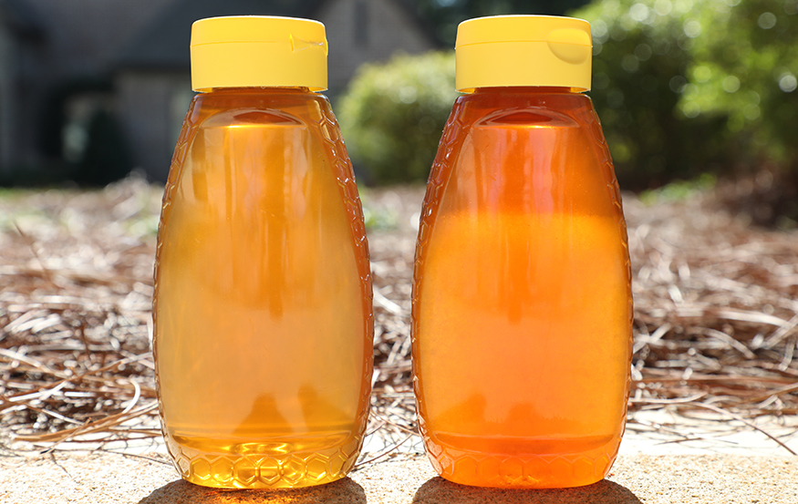 Two bottles of granulated honey