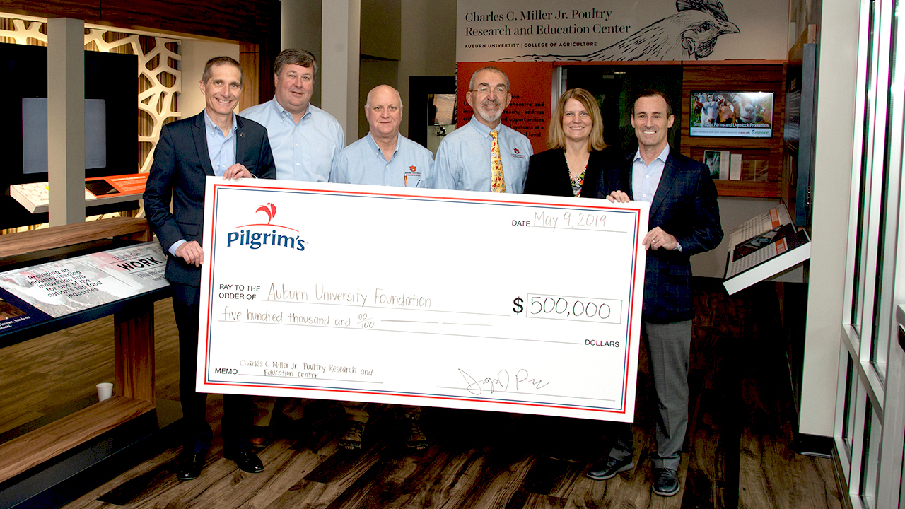 Pilgrim's check presentation with Auburn Miller Poultry Center, Alabama