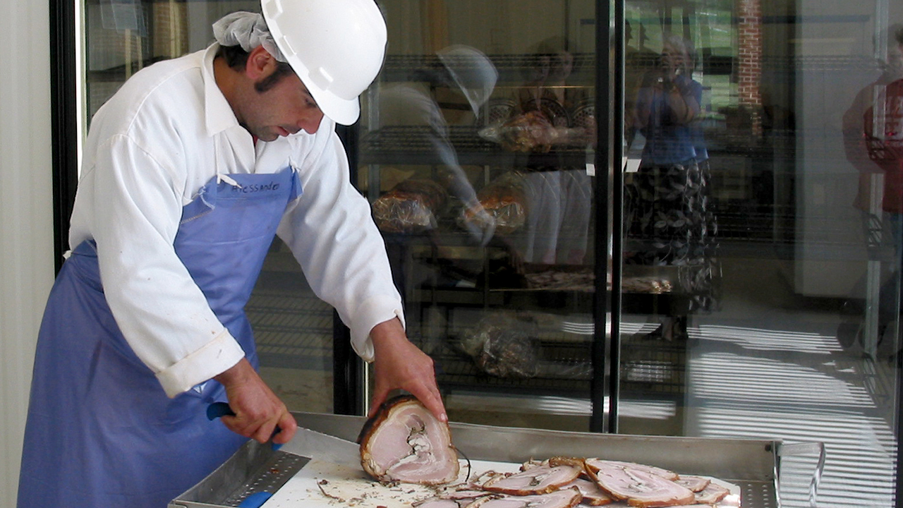 Alessandro-slicing-meat-with-knife-Auburn-Meats-Lab