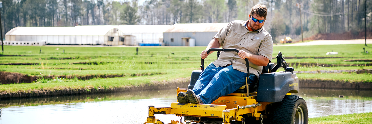 Mower-cutting-grass-around-EW-Shell-Fisheries-Ponds-Alabama-Auburn-Ag-Land-Resource-Management-COA