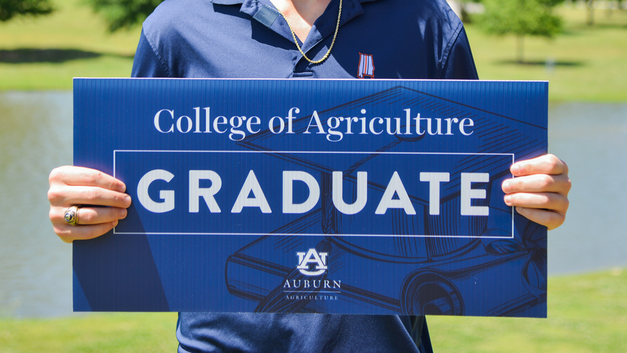 COA-Auburn-Summer-Graduate-Student-In-front-of-lake-2022