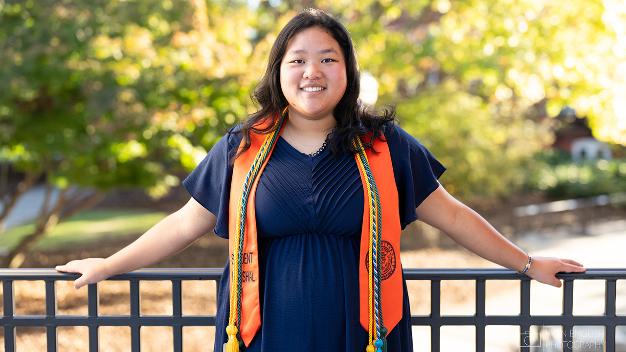 Rachel Robinson dons her honors tassels and smiles for a picture on the Auburn campus