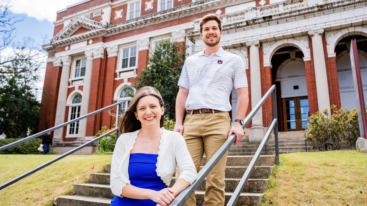 Two students stand on the front steps of Comer Hall