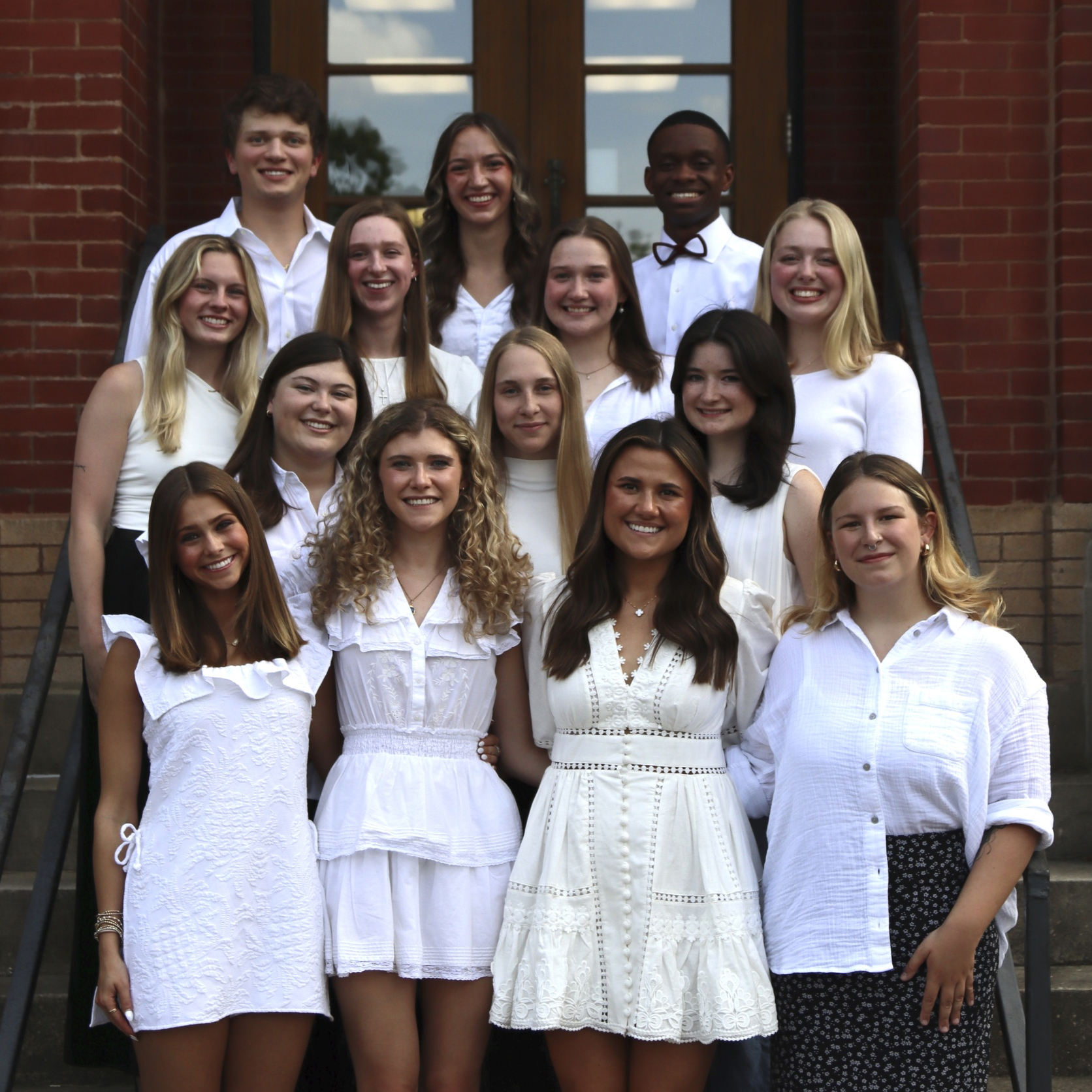 Ag-Peer-Mentors-2025 Group photo of the 2025-2026 Ag Peer Mentors taken outside on steps in front of a brick building.