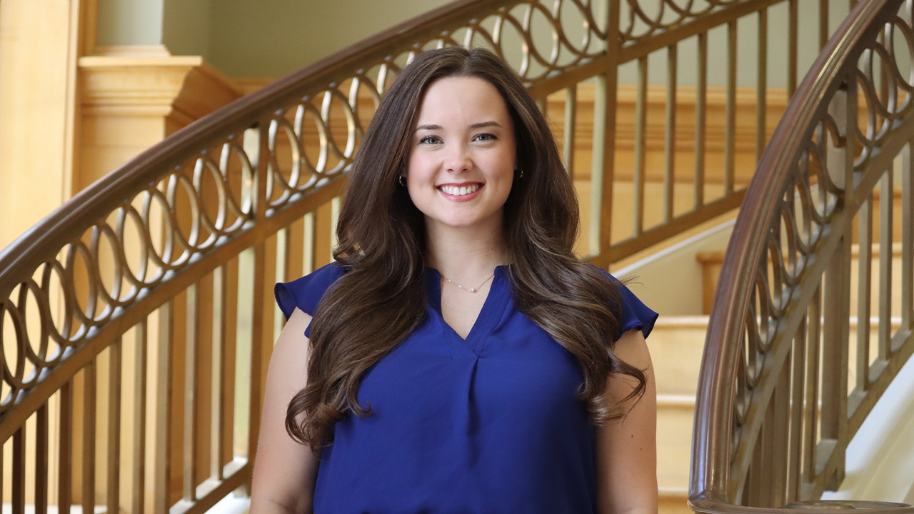 20251002-ally-jackson-poultry-science-third-auburn-degree Ally Jackson smiles for a photo in the lobby of the Poultry Science Building